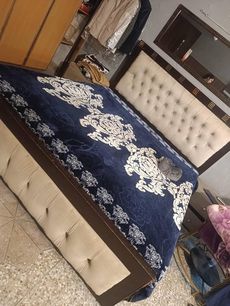 double bed with side table. 0