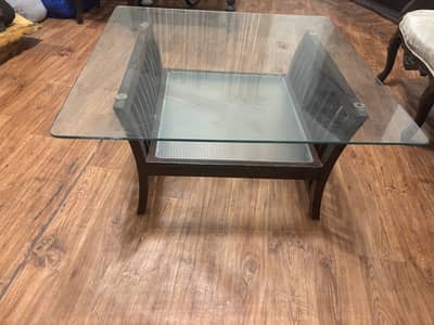 Center Table with solid body and glass