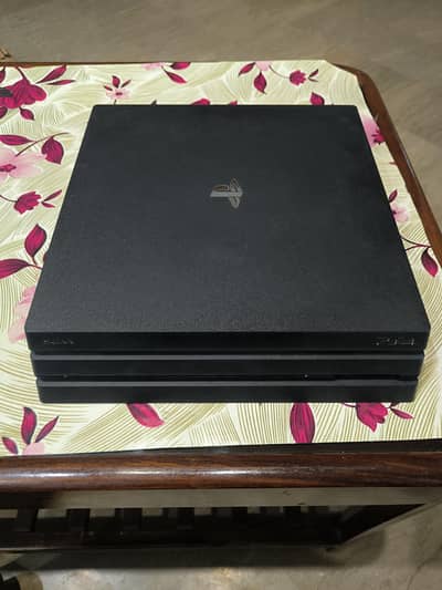 PS4 PRO 1TB with original wires and two games for sale
