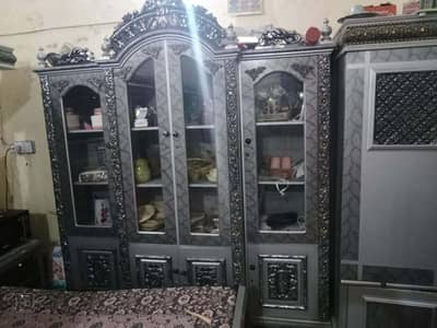 bed with side tables, dressing table, showcase,3doors almirah.