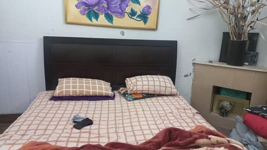 King size bed without mattress.