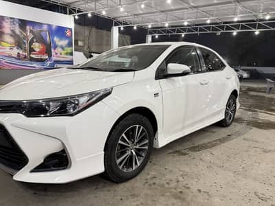 Toyota Corolla Altis 1.6 super white color just like zero metar cond