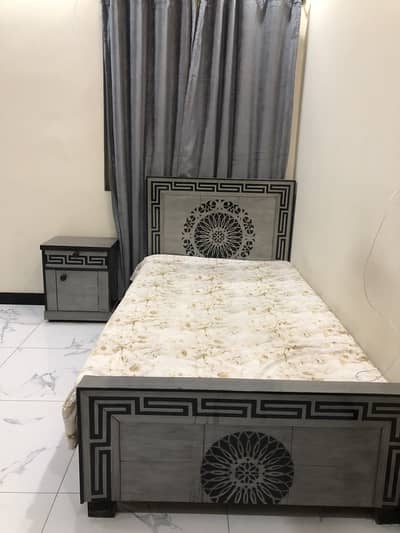 Single bed with side table