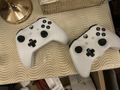 X box one s with 2 consoles 1tb hard drive