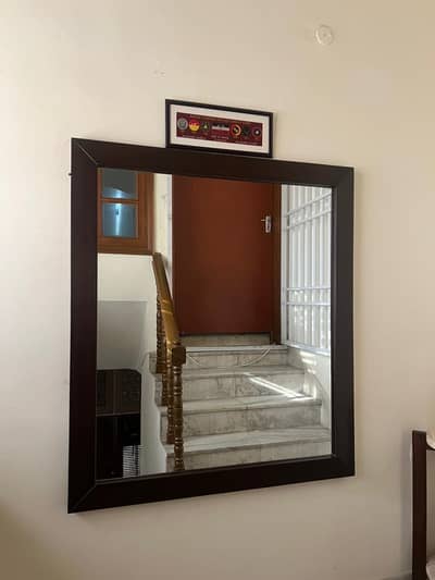 Mirror with brown wooden frame