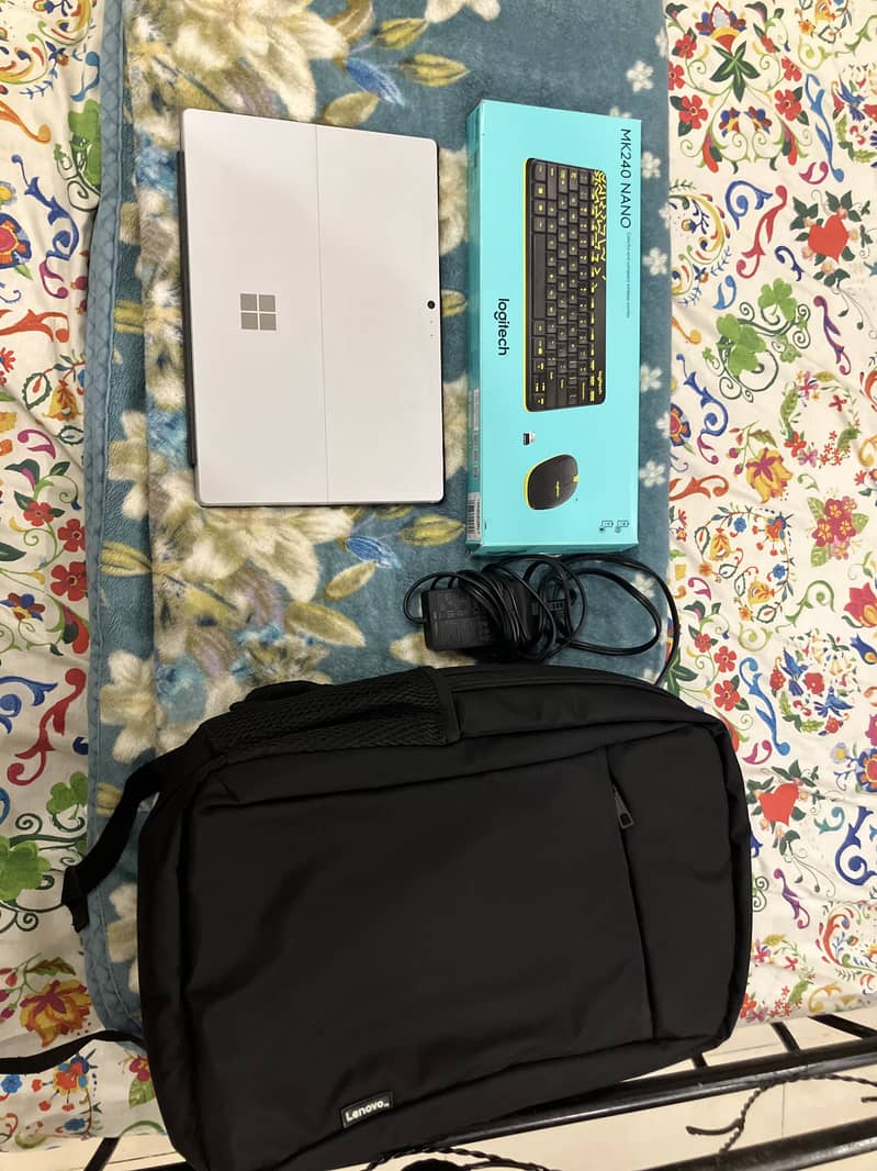 URGENT SELL:Microsoft surface pro 4 with Logitech wireless combo set. 1