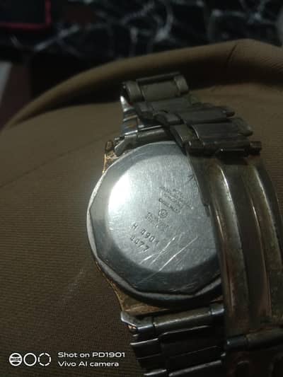 swiss madewatch with several specific identifying feature (1970to1980