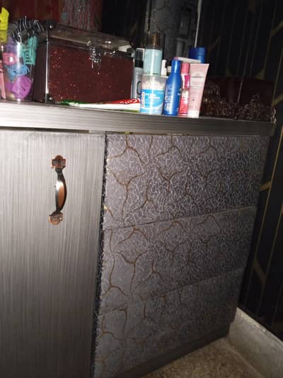 bed; 2 side tables; a dressing table ;three door wardrobe