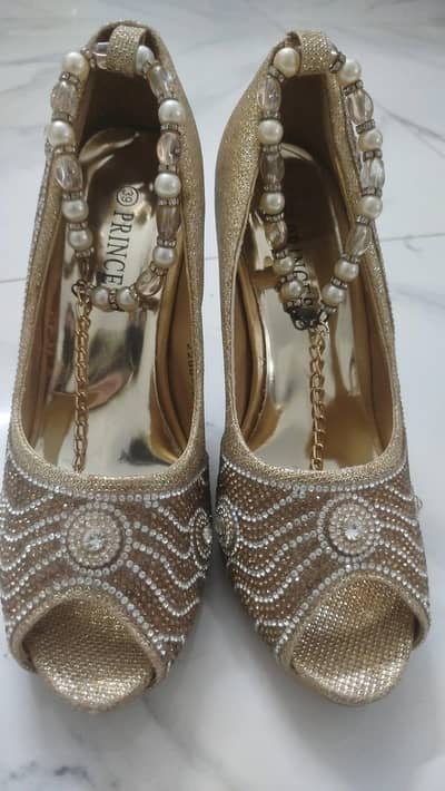 fancy and wedding wear heels  in very new condition. . size 39