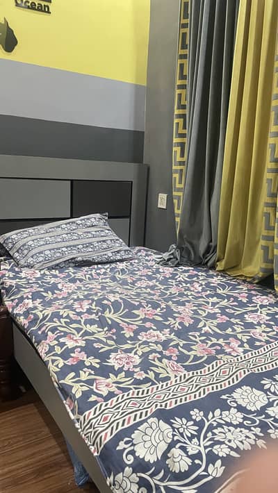 Small Bed with Built-in Side Table – Ideal for Students.