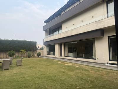 Stunning 2 Kanal Luxury House with Expansive 1 Kanal Lush Green Lawn in Sector B, DHA Phase 6 Lahore For Sale