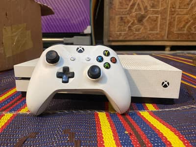 Xbox oneS 1TB with one controller and plenty of games like GTA 5 Ass. .