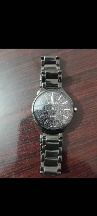 Rado Ceramic watch . . black dial blue shining