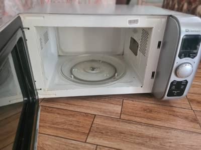 Dawlance Microwave Oven - Compact, Multi-Function for Heating & Cooki