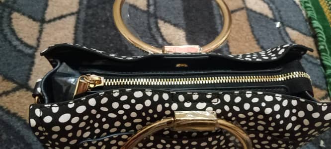 brand new uk bag black colur golden handle