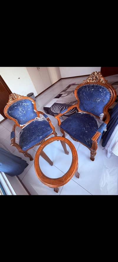 room coffee table set of two chairs and one table