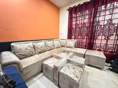 L shaped sofa with center table 4 puffy