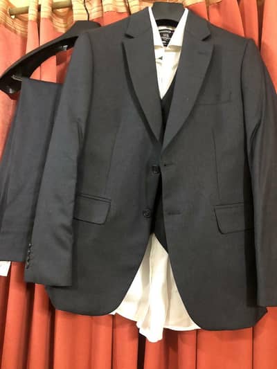 A 3 piece suit, short and Formal Shoes