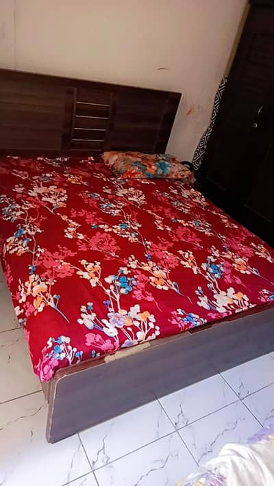 old medium size bed with side table