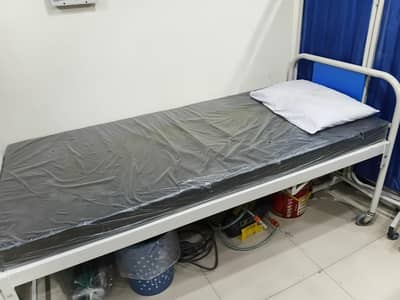 Patient bed with mattress