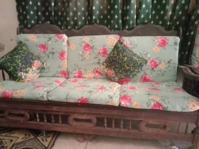 wooden sofa with cushions
