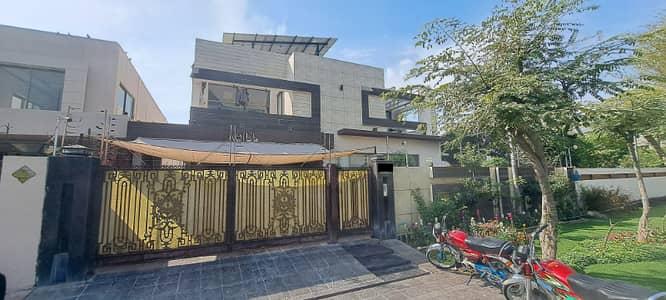 One Kanal Slightly Luxury Modern Design Most Beautiful Full Basement Fully Furnished Bungalow 15KV Solar Installed For Sale At Prime Location Of DHA Lahore Near To Park Masjid & Commercial Market.