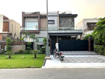One Kanal Brand New Luxury Ultra-Modern Design Most Beautiful Fully Furnished Bungalow 15KV Solar Installed 2 Servant Quarter In Basement For Sale At Prime Location Of DHA Lahore Near To Park Masjid & Commercial Market.
