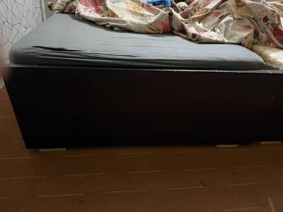 2 Single brown wooden bed