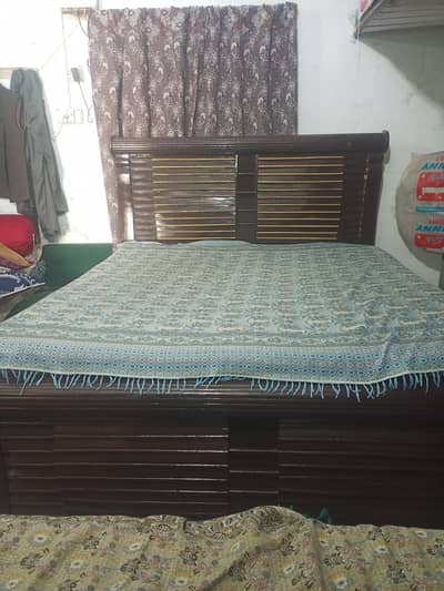 Double wooden bed with spring matrix