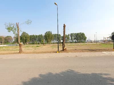 9 Marla On Ground Facing Canal And Canal Road Lahore With 50' Road On Its Front Side And 50' Road On Its Back Side Along With 30' And 20' Dedicated Parking , Ready For Construction. Super Hot Thing In It Is That The Plot Is Open Form. .