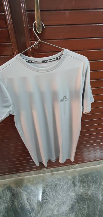 Adidas sports tee with comfort fit and versatile design