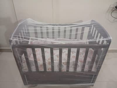 Wooden Baby cot + mosquito net + 2 large storage drawer