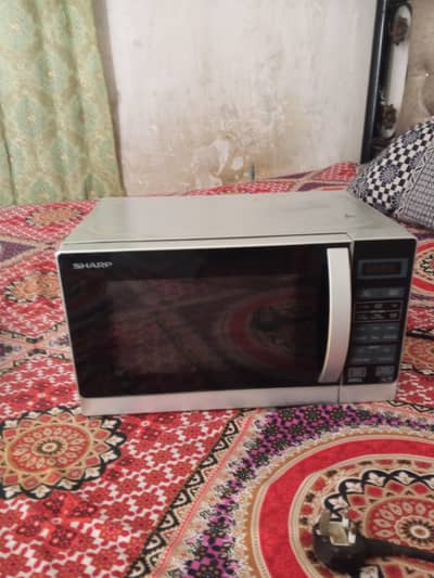 Sharp company microwave oven used but looking new and at buyable price