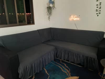 5 seater L-shaped sofa with covers for 12k only