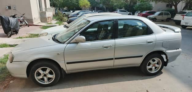 Suzuki Baleno 2004 – Silver | Neat, Reliable and Well-Kept Ride