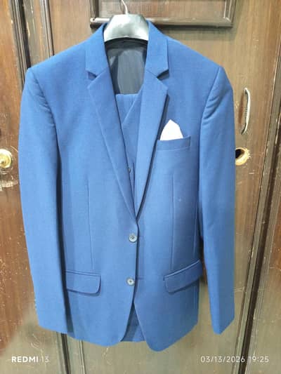 party wear blue paint coat .