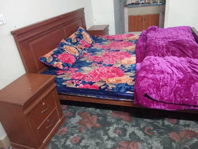 king size bed with side table