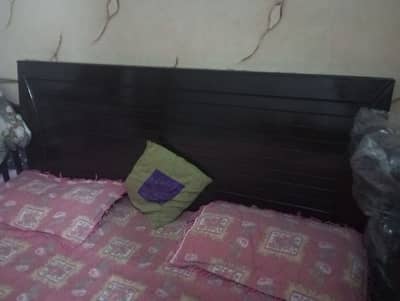 wooden bed with new mattress