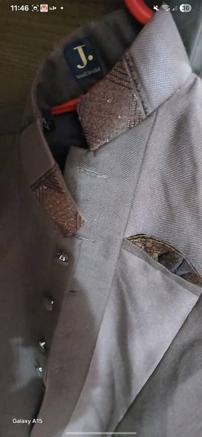 j. sherwani and girl orange suit