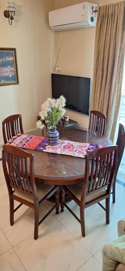 6 seater Wooden dining table with 8mm glass top available for sale