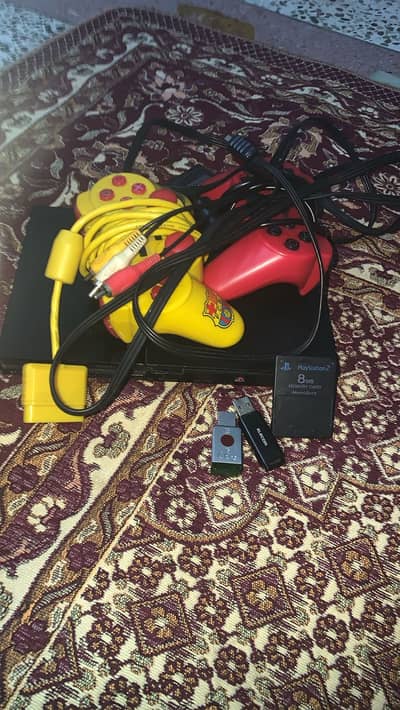 Playstation 2 jailbroken with 2 controllers & 2 usb filled with games