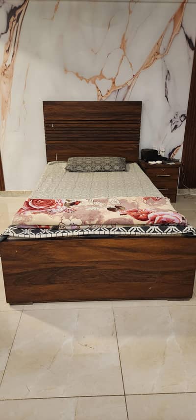 Single bed available for sell with side table.