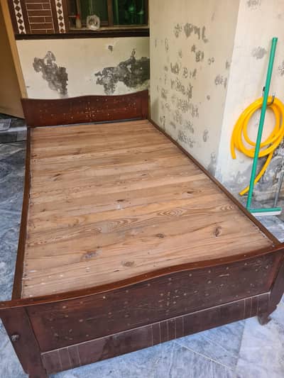 single wooden bed. durable