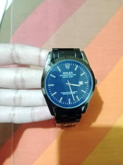 Rolex oyster perpetual watch in black colour