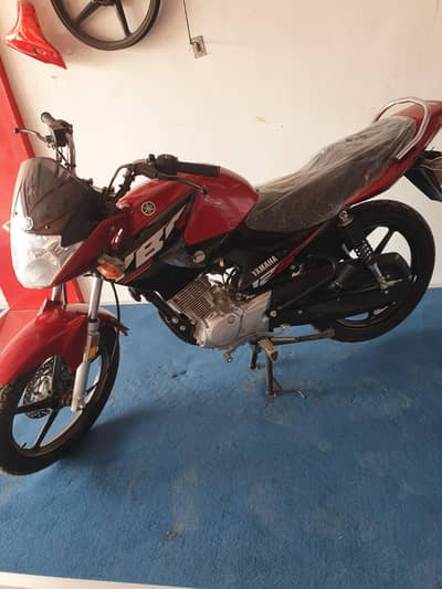 yamaha 125 red colour zero meter bike for sale open voucher ha