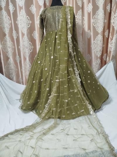 Stitched Net Umbrella frock (medium size )  with sequence embroidery.