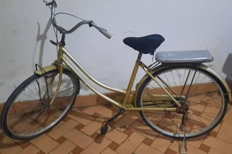 used typhoon Japanese cycle with new seat cover and padded back seat.