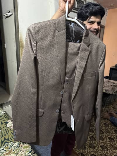 Three piece suit brown