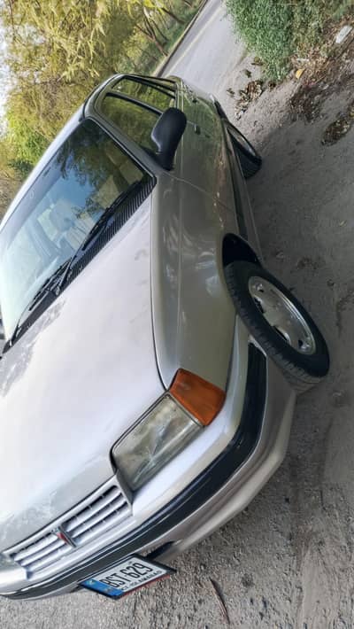 Daewoo racer for sale in Islamabad like new car original Rim and tire