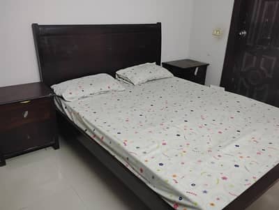 bed with side tables and dressing and mattress